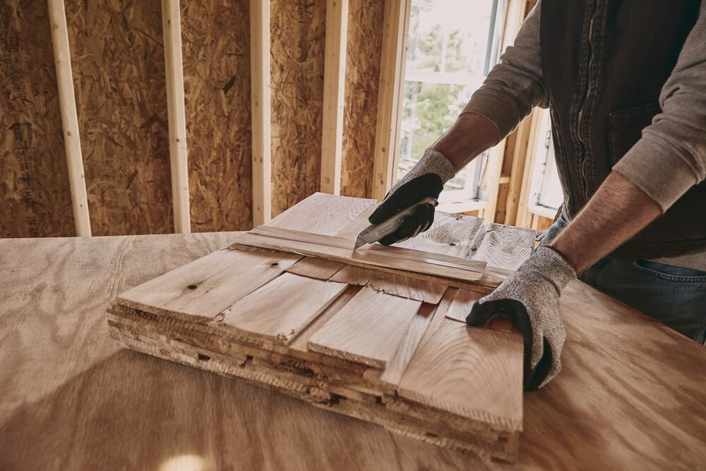 6 Inch Classic 99 retractable utility knife cutting wooden plank.