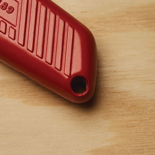 Lanyard hang hole feature of Self retracting safety utility knife.