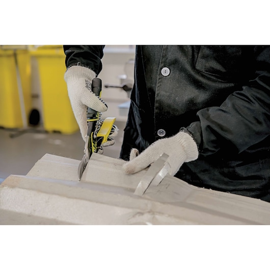 Fat max straight cut compound action aviation snips being used to cut a sheet.