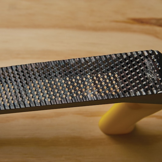 Replacement blade feature in 10 inch surform plane type regular cut blade.