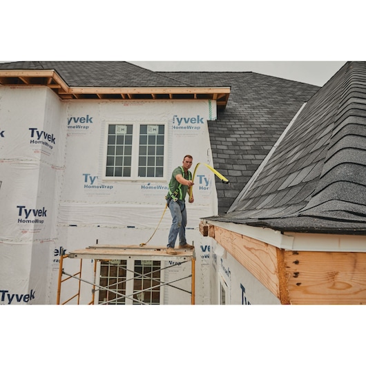 25 foot FATMAX classic tape measure being used by a person to measure distance.