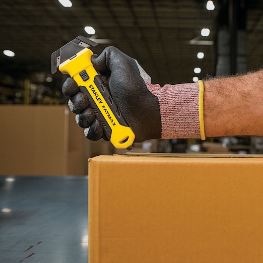 Fatmax double sided replaceable head pull cutter being used to cut a box.