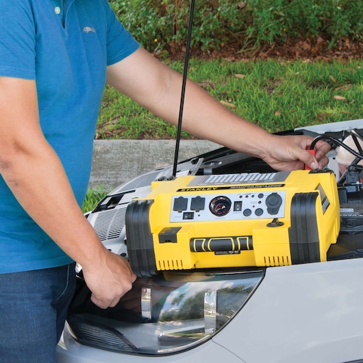 500 instant 1000 peak battery Amp professional power station being used to charge a car engine.