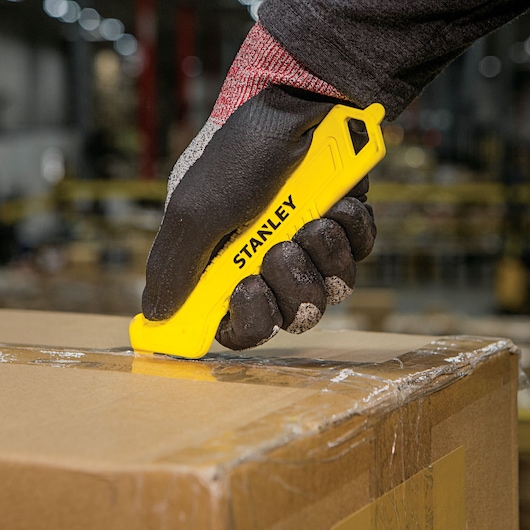 Single Sided Pull Cutter Hook piercer side being used for opening boxes.