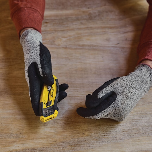 CONTROL GRIP RETRACTABLE UTILITY KNIFE being used.